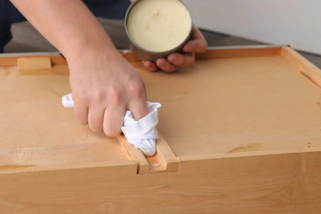 rubbing carnauba wax in drawer tracks scaled 1