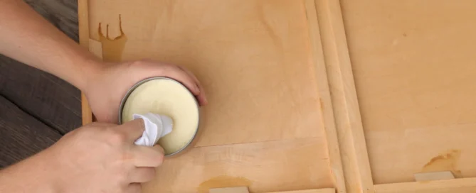 Dipping clothher into wood wax