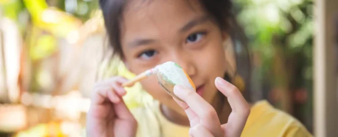 Little Girl doing Rock Paint