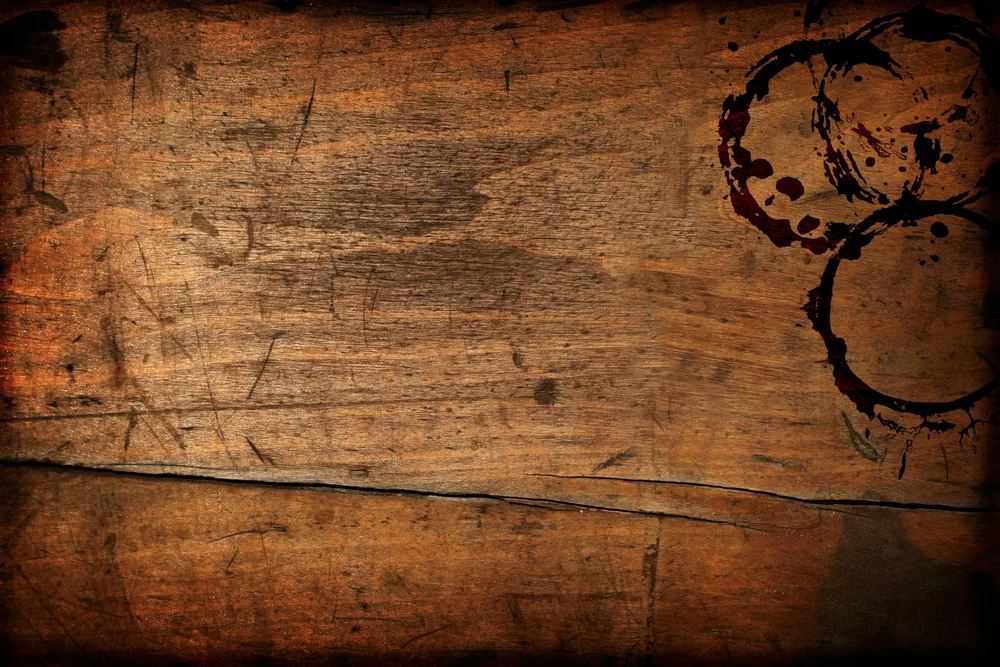 Dark vintage wood table texture with cup stains, showing the need to remove stains from wood