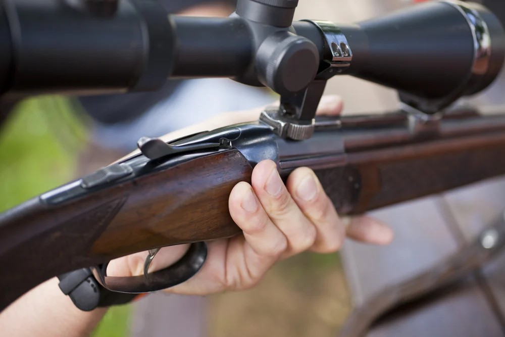 man holding his gun refinished with tung oil finish from Real Milk Paint