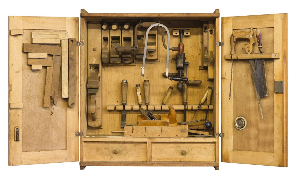 DIY wood toolbox with drawer bottom and different tools inside