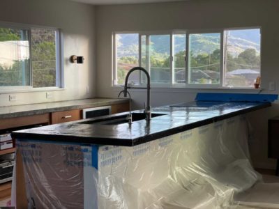 Finished concrete countertops with smooth and textured surface options for modern kitchens