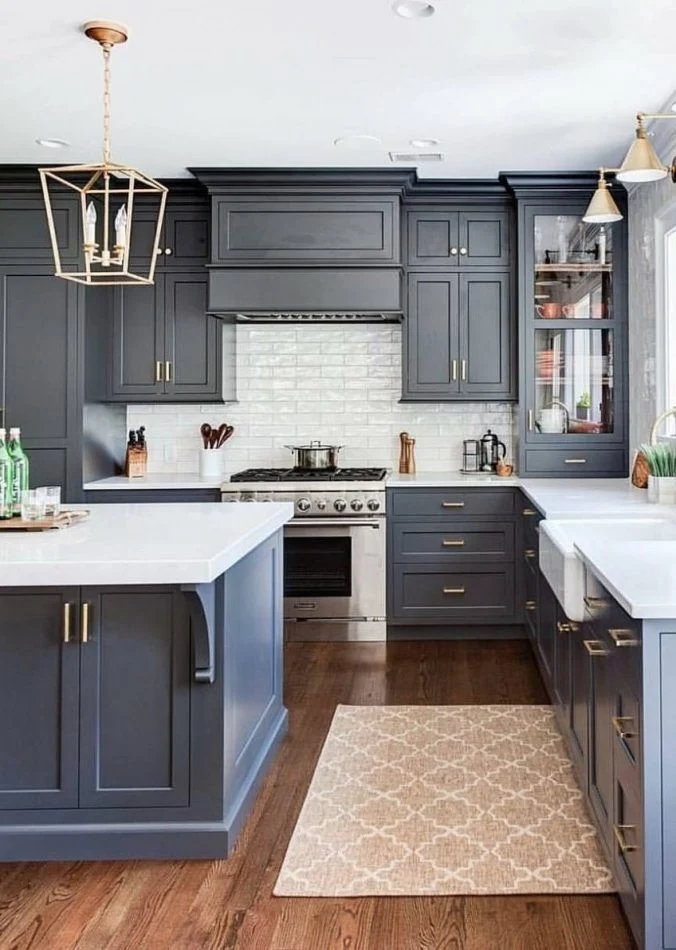 Applying the first paint coat on kitchen cabinets using eco-friendly milk paint for a smooth, even finish