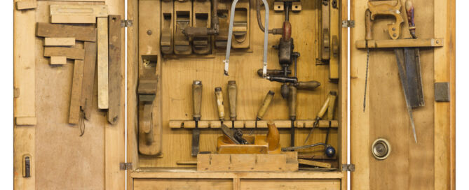 DIY wood toolbox with drawer bottom and different tools inside