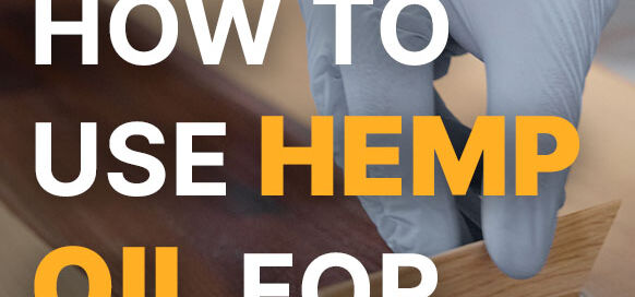 Closeup of workers hand covering wooden plank with Hemp-Oil from Real Milk Paint