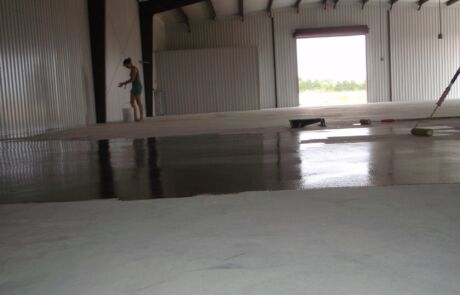 Oiling concrete floors of warehouse Real Milk Paint Co 2010