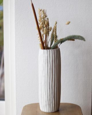 green woodworkers vase finished product with dry wood inside