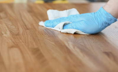 cleaning the dining table and removing sanding dust before painting