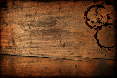 Dark vintage wood table texture with cup stains, showing the need to remove stains from wood